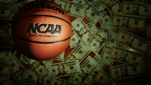 Eveleth, MN USA 03 08 2022: An NCAA Final Four Edition basketball surrounded by money