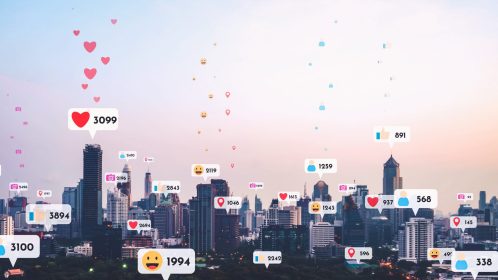 Social media icons fly over city downtown showing people reciprocity connection